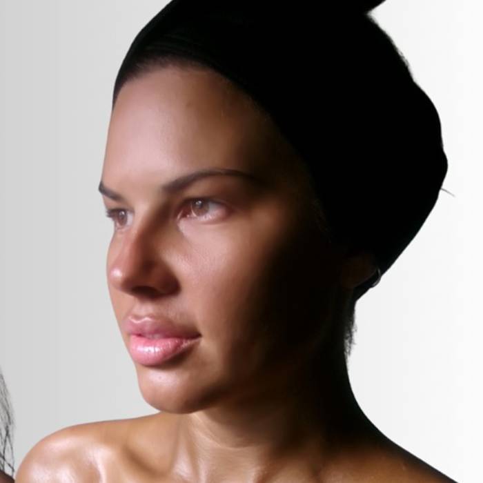 the same client's warm, even glow after her spray tan