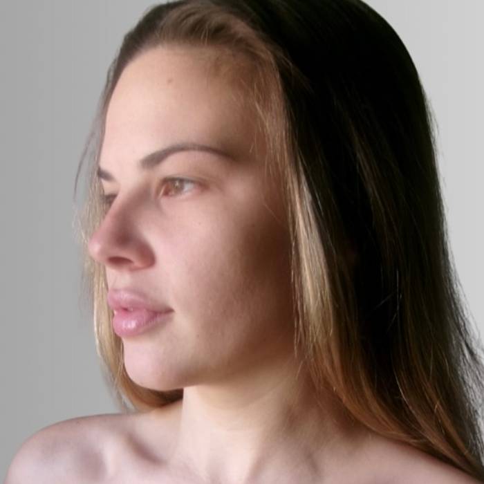 a client's untanned skin tone before her spray tan